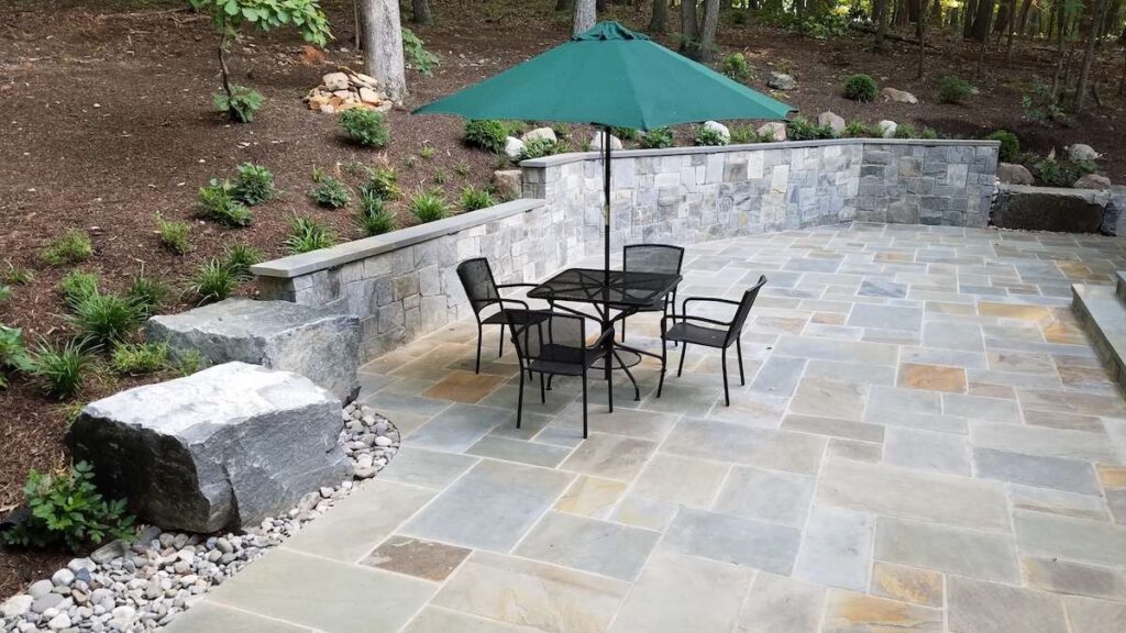 Bespoke stone patio in a landscaped Swansea garden