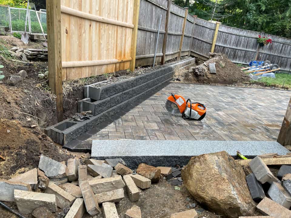 Outdoor patio installation in progress in Swansea garden
